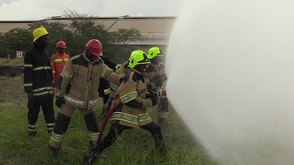 Training of use of water shield to block heat radiation from fire at KPRL Fire School during training of Mombasa County Fire and Rescue Team Members