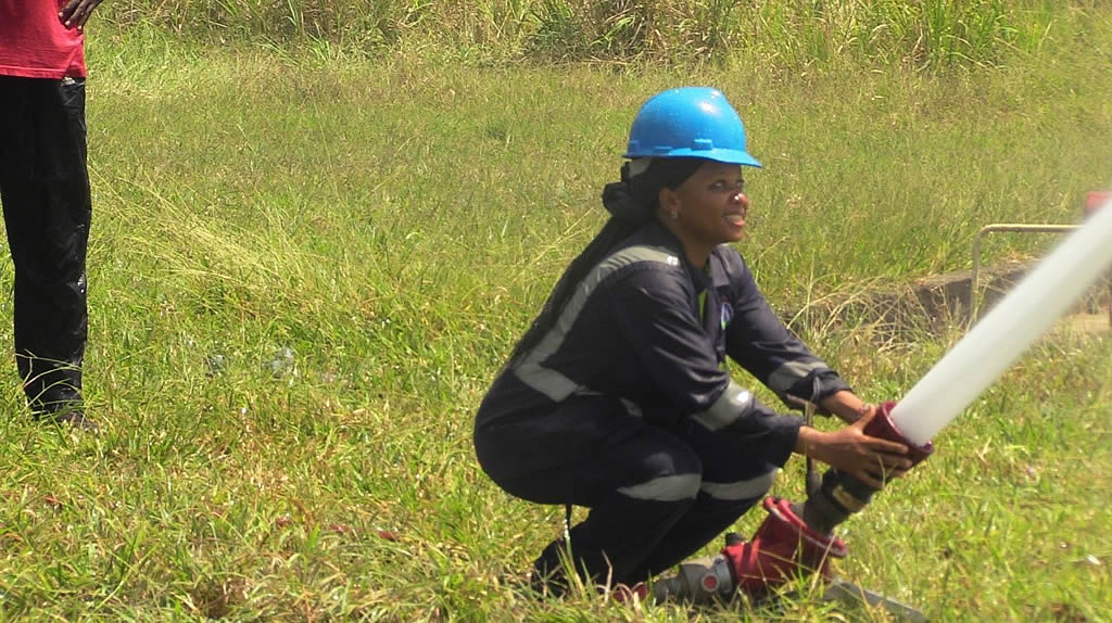 FIT Member, Peninah Mriwe from Operations department having hands-on training on use of Ground Monitor at KPRL Fire Training Grounds on 21/02/2024
